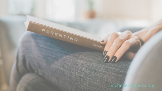 parenting book on lap